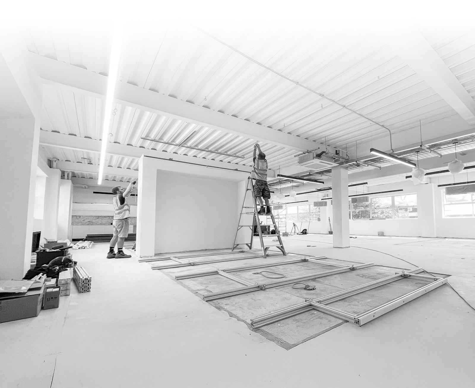 Collab operative working at height during an office strip-out
