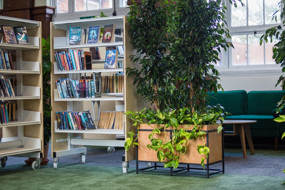 Library shelving with planters